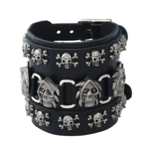Antique silver skull leather cuff bracelet for men with multiple skull charms and wide genuine leather strap, overhead view