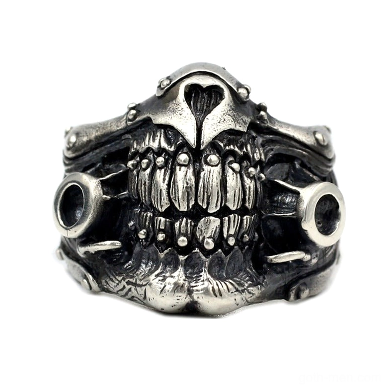 Punk rock statement skull ring front-facing view highlighting hollow circular side ports and combat design