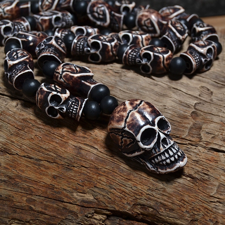 Gothic skull necklace pendant close-up anatomical carved details