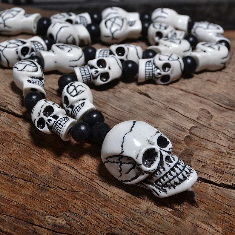 Gothic skull pendant necklace flat lay full length with spacer beads