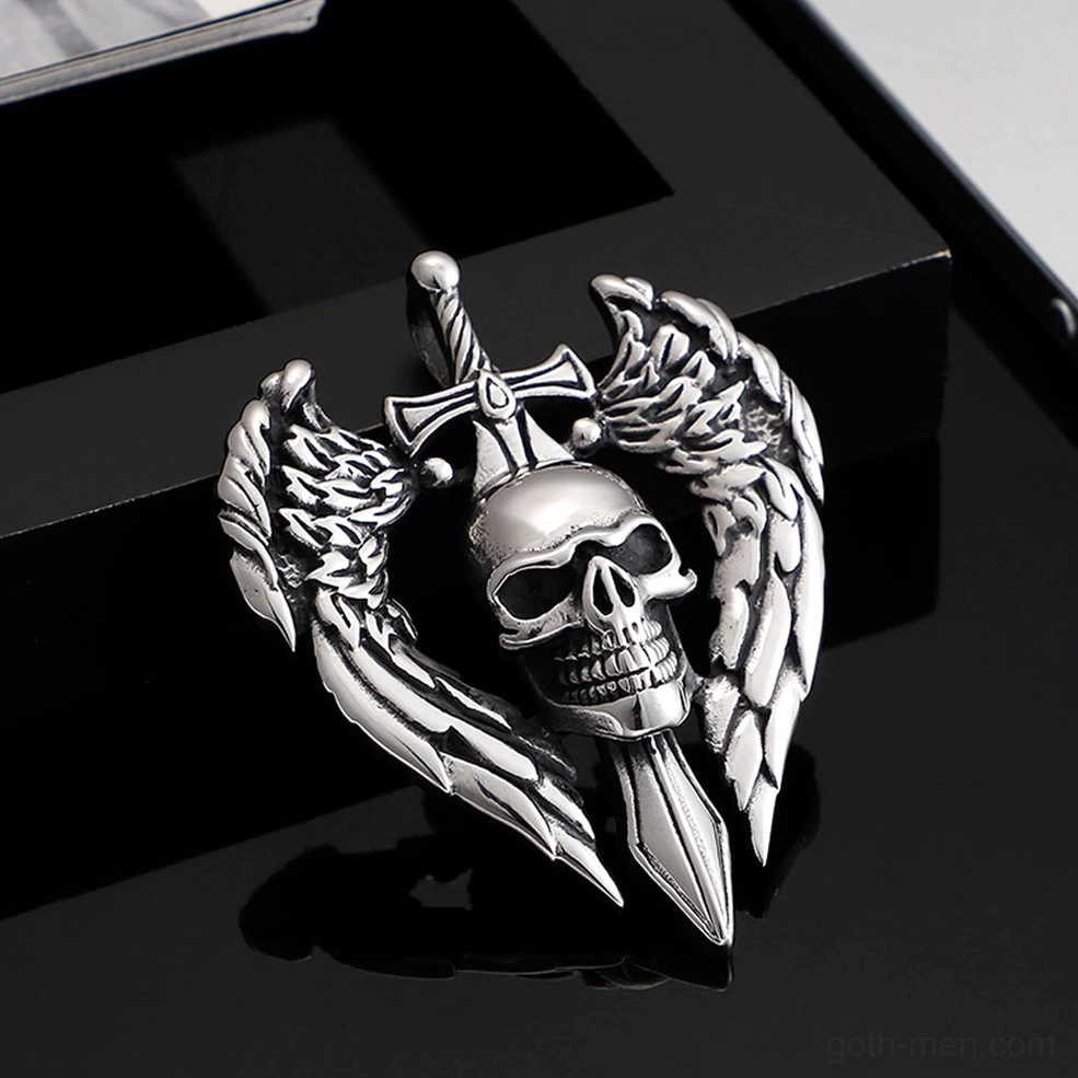 Flat lay of gothic angel wing skull pendant necklace on reflective black surface showing product reflection