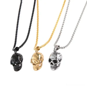 Stainless steel skull pendant necklace collection - three color variants in black, gold, and silver displayed together on white background