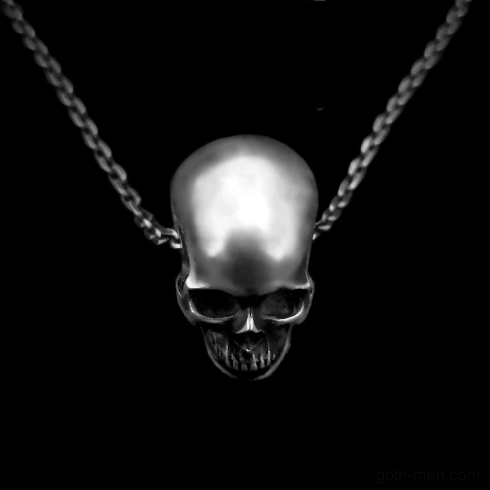 Dark aged silver finish skull pendant top-front view on black background displaying flat-top skull design