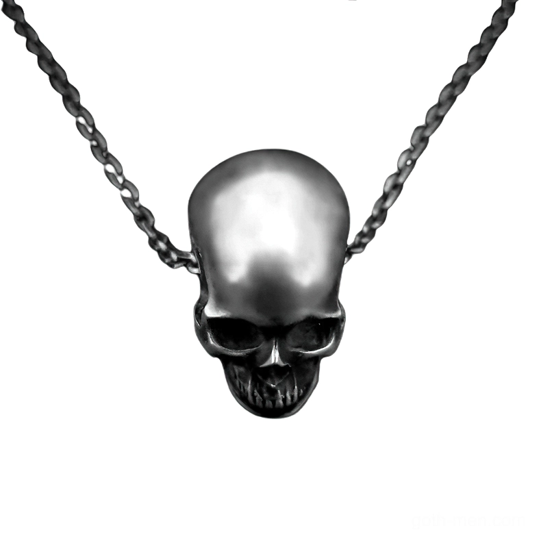 Aged dark silver skull pendant necklace top-front angle showing flat skull design and texture