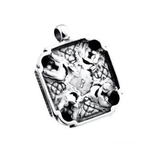 Back side of gothic skull pendant showing embossed dark relief pattern and polished stainless steel texture with Celtic designs