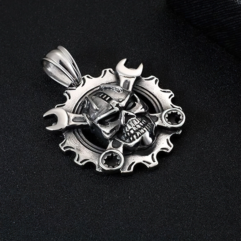 Detailed engraved mechanical skull pendant with silver patina finish and intricate bone structure