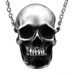 Realistic silver-toned skull pendant necklace close-up frontal view showcasing intricate anatomical detail and curb chain
