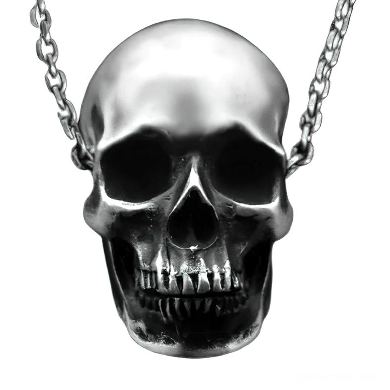 Realistic silver-toned skull pendant necklace close-up frontal view showcasing intricate anatomical detail and curb chain