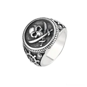 Gothic skull pirate signet ring with crossed swords and ship wheel detail, silver-tone stainless steel, front three-quarter view