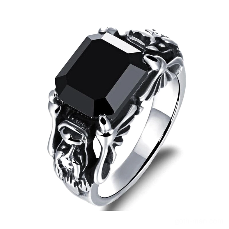 Black zircon gothic skull ring with 316L stainless steel band, three-quarter front view showing carved skull motifs and square cut gemstone