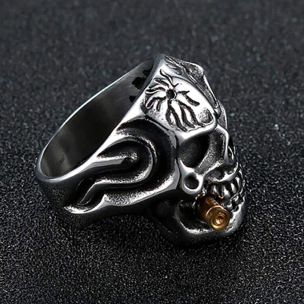 Clear crystal pirate skull biker ring dark background detailed view of gothic bone carving and metalwork