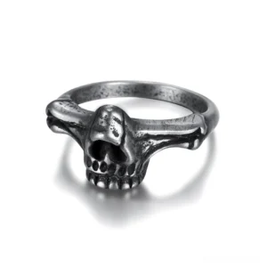 Black stainless steel gothic skull ring frontal view showing detailed skeleton carving and memento mori design