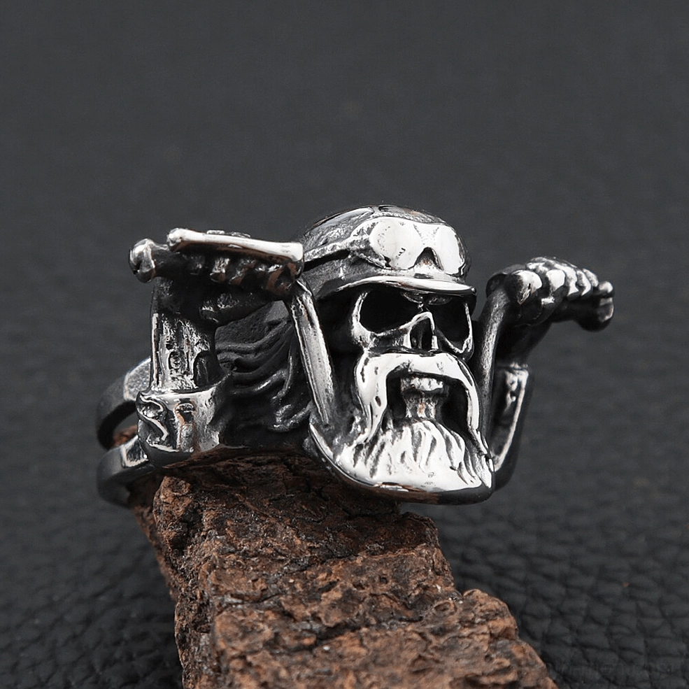 Detailed gothic skull biker ring with helmet and goggles three-quarter view on leather display
