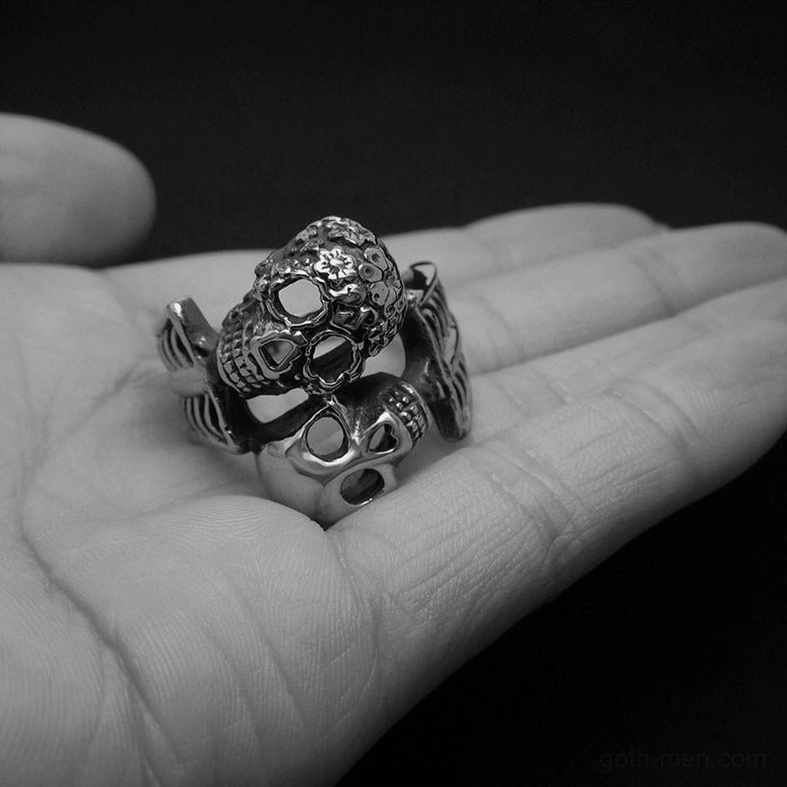 Dual skull gothic ring worn on hand showing fit and presence on finger
