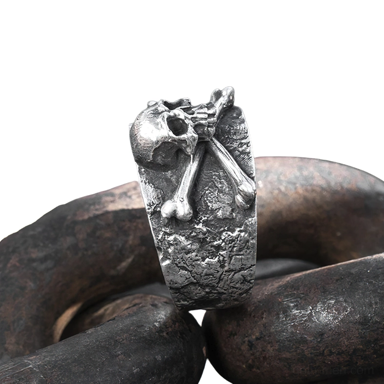 Side close-up view of adjustable gothic skull ring on aged chain showing vertical profile and aged silver patina