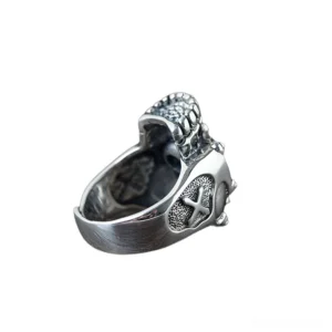 Adjustable gothic skull ring side profile showing engraved cross detail and studded band