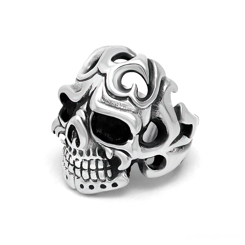 Gothic hollow skull stainless steel ring with tribal carved patterns, front flat view on white background showing vintage silver finish