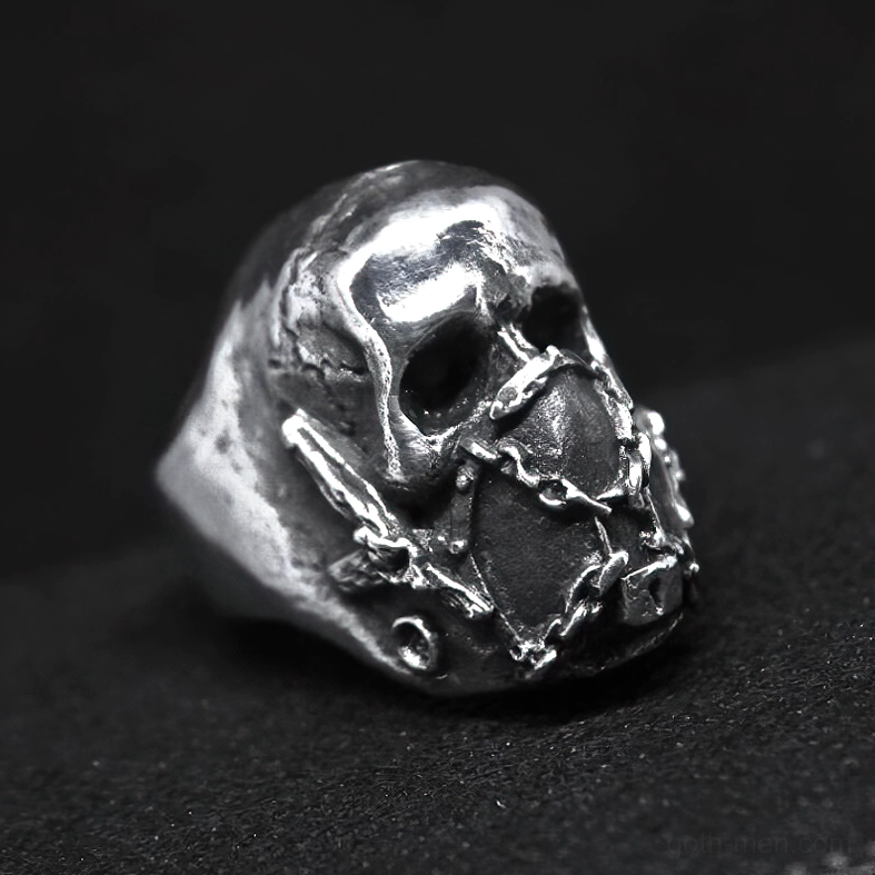 Vintage-style stainless steel skull ring with chain mask mechanism, 3/4 front right angle perspective