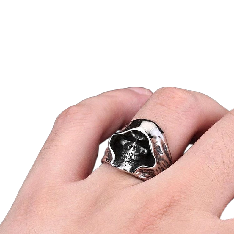 Hooded skull punk ring worn on male hand close-up showing fit and antique silver finish with hollowed skull design
