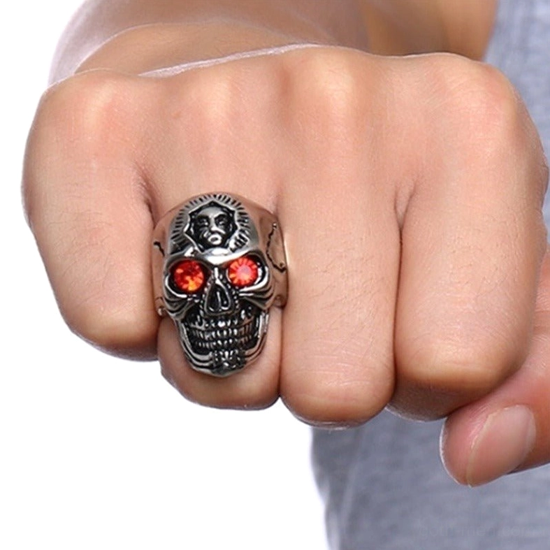 Memento mori skull ring worn on hand, showcasing bold gothic aesthetic and punk rock style in everyday wear