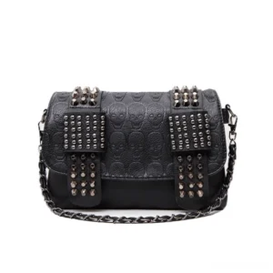 Black skull embossed rivet studded crossbody messenger bag front flat lay view with metal spike decorations and chain shoulder strap on white background