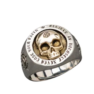 Gothic skull signet ring in sterling silver with two-tone metal finish, engraved sun motifs on band, left front oblique view