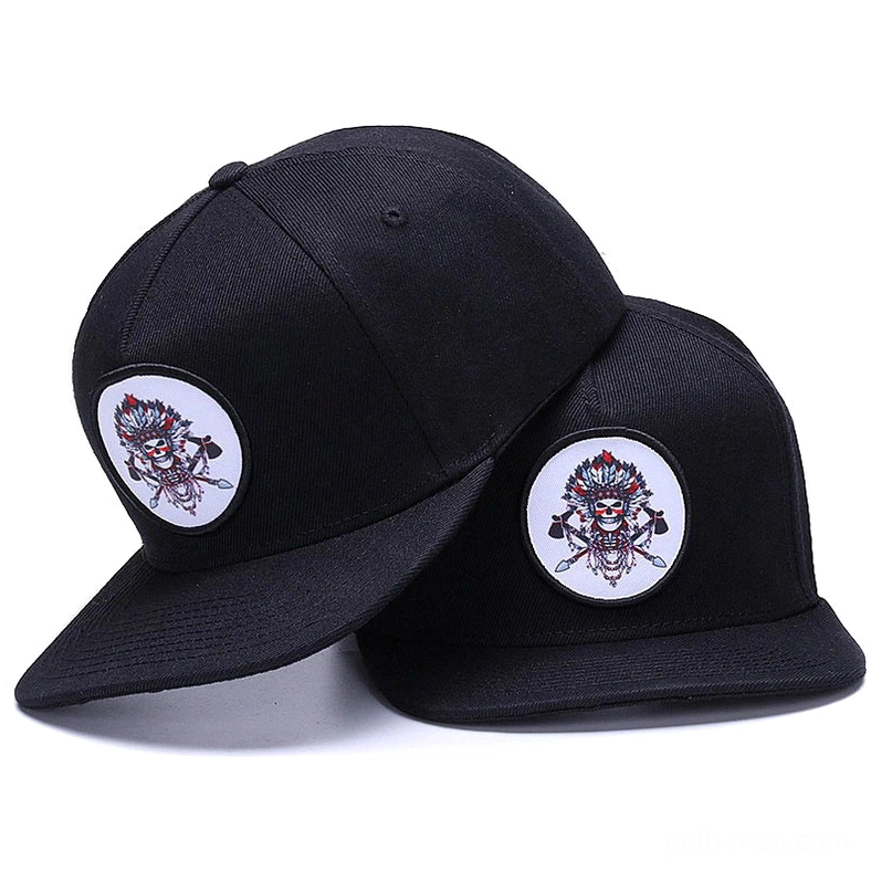 Black and white skull embroidered gothic snapback caps displayed side by side on white background, showing three-quarter view with adjustable back straps