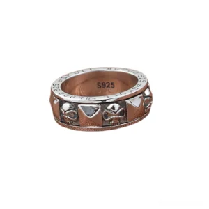 S925 hallmarked skull ring top-down closeup showing spinner mechanism and pyramid motifs