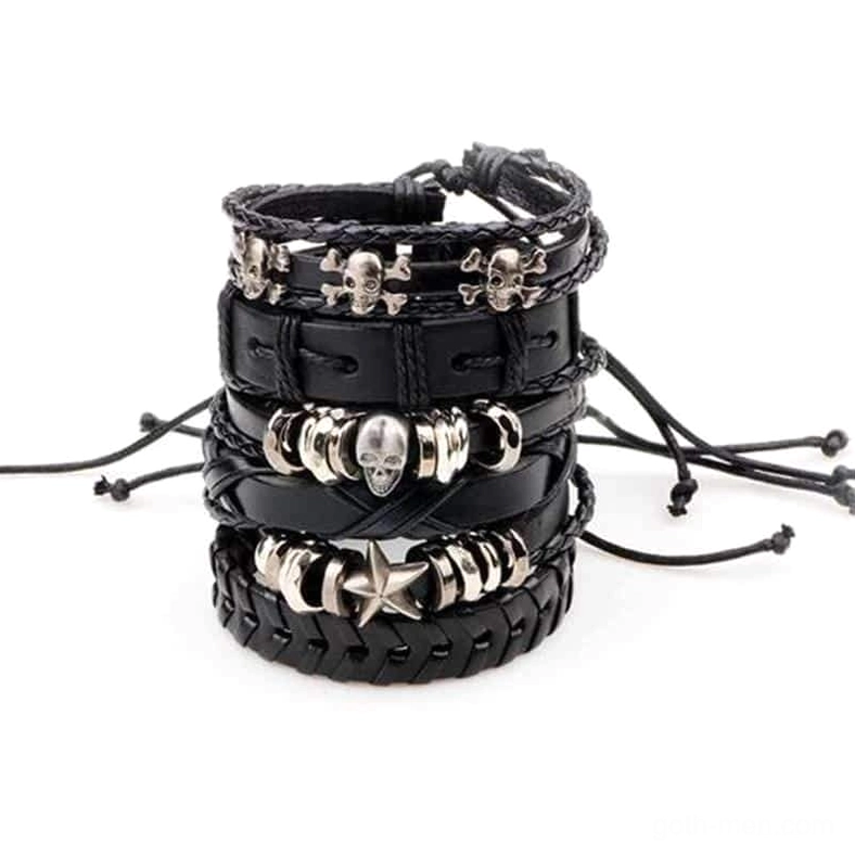 Adjustable black leather gothic bracelets with skull and star metal charms detail view
