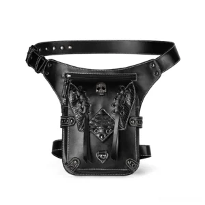 Gothic skull leather thigh bag front view with metal ornament and contrast stitching on white background