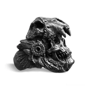 Aged black metal warrior skull ring with intricate feather and totem details, side profile perspective
