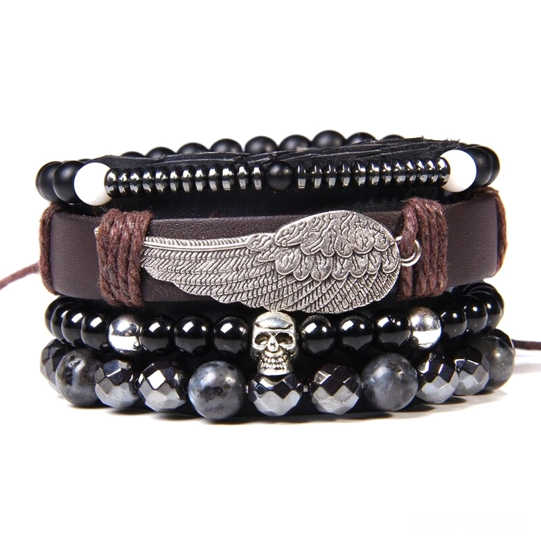 Black gothic skull wing charm bracelet with layered beads and silver accents, dark alternative jewelry
