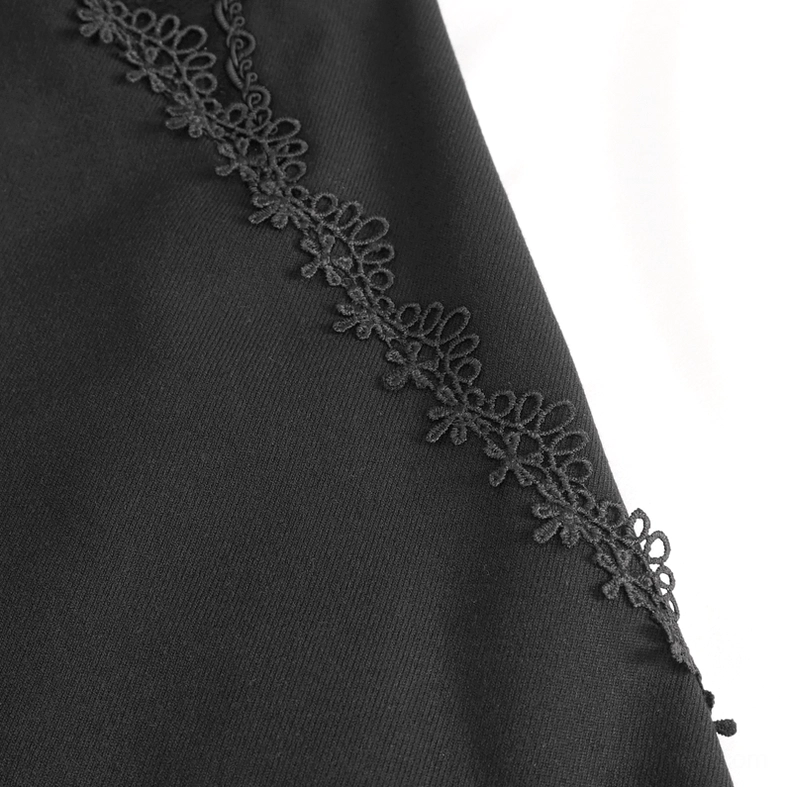 Close-up of gothic trousers seam trim featuring floral embroidered lace and solid black woven fabric construction