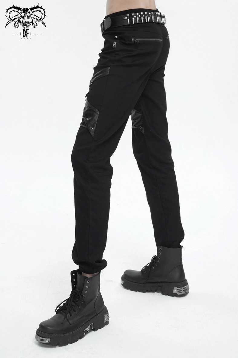 Black gothic trousers flat lay detail showing fabric weave and construction quality