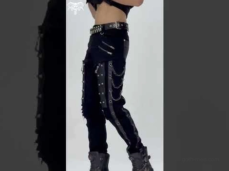 Black gothic slim-fit pants side view detail showing multi-chain accents and studded belt