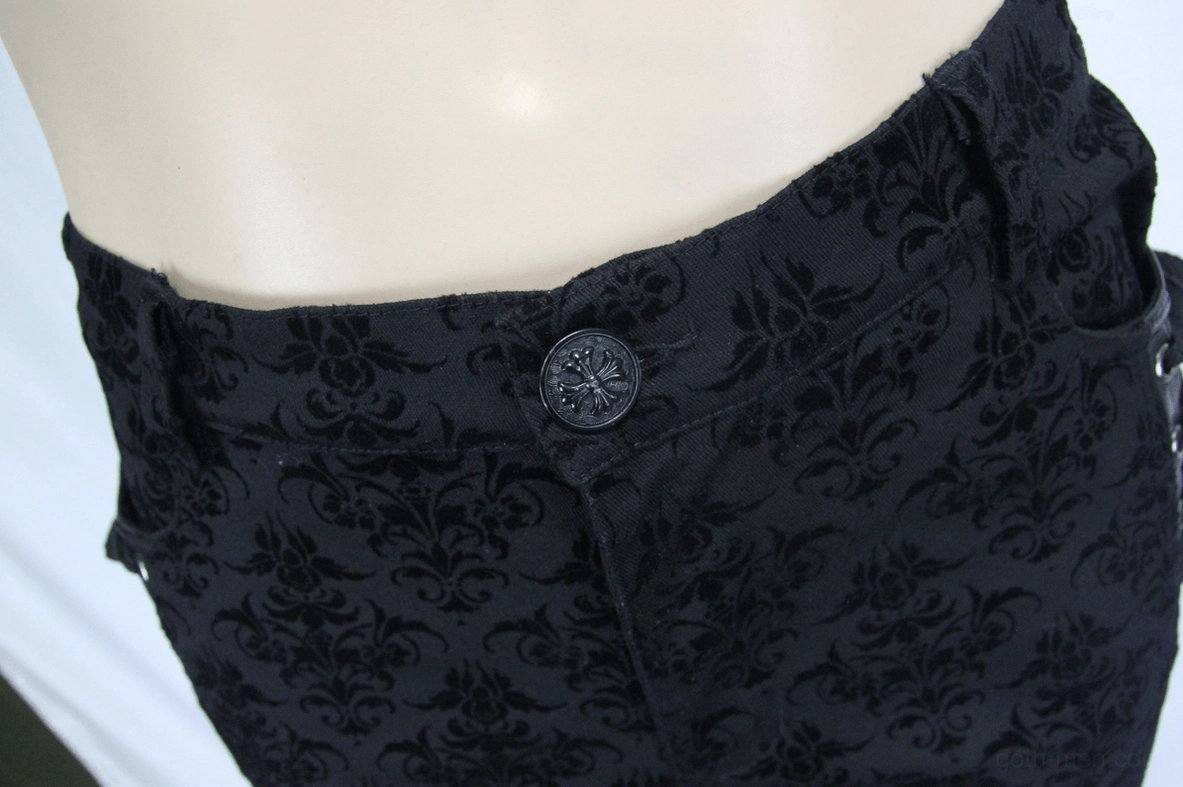 Front waist close-up of steampunk gothic pants showing button fly, belt loops, and damask floral texture detail