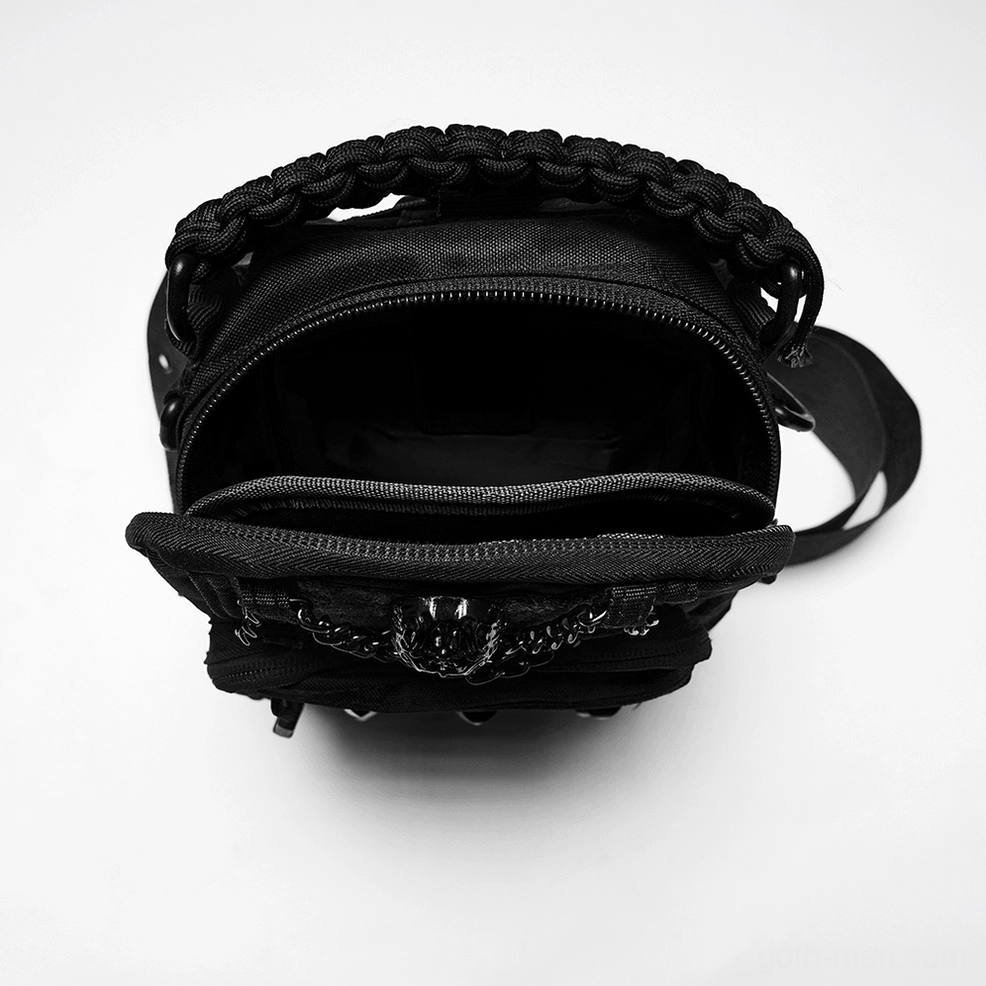 Interior view of gothic crossbody sling backpack showing compartments and chain decoration