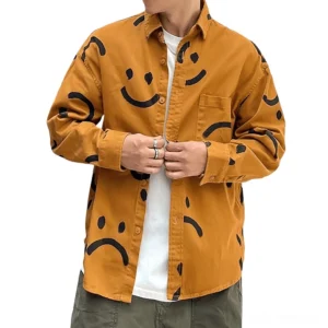 Men's gothic smiley graffiti print shirt in burnt orange with hand-drawn smile face, worn by adult male model in casual daily setting, front view