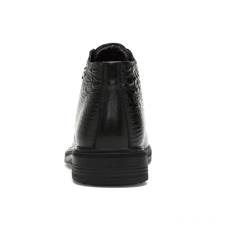 Black smooth leather gothic ankle boot with round toe and metal fasteners, side view demonstration