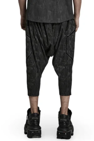 Dark snake grain textured harem cropped trousers back view on model