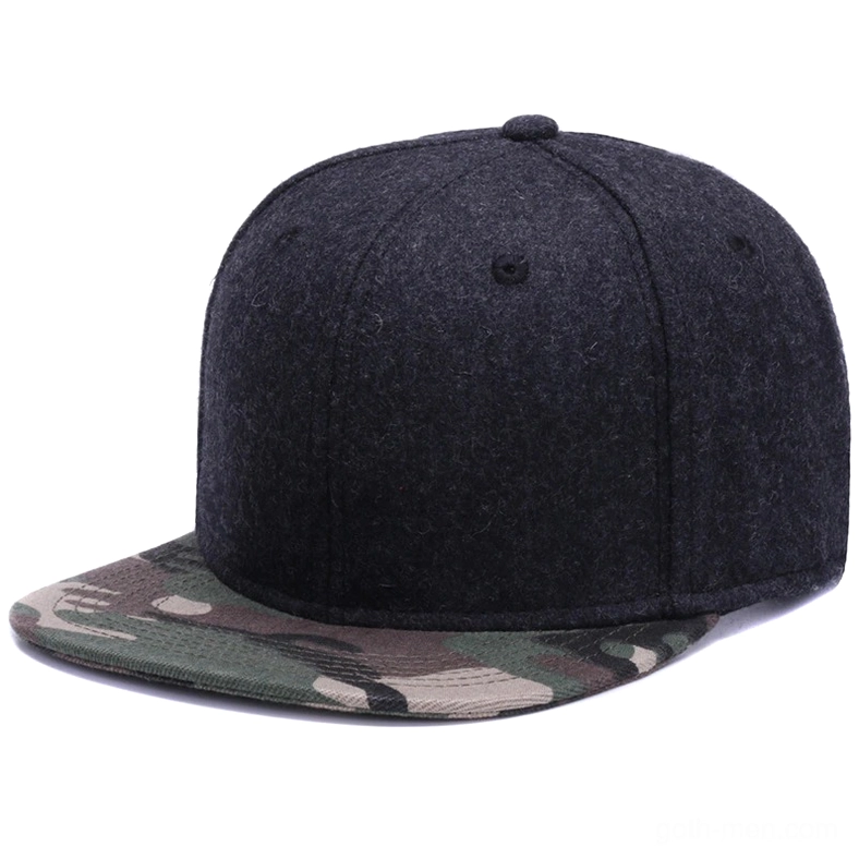 Dark grey wool gothic snapback cap with camouflage patterned brim, three-quarter side angle showing geometric design elements