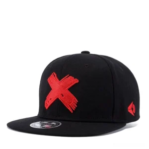 Black gothic snapback baseball cap with red embroidered X motif, flat brim design, three-quarter front view
