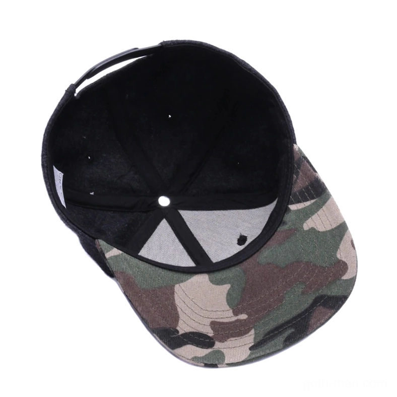 Interior view of gothic snapback cap showing black inner lining and camouflage pattern outer brim, top-down perspective