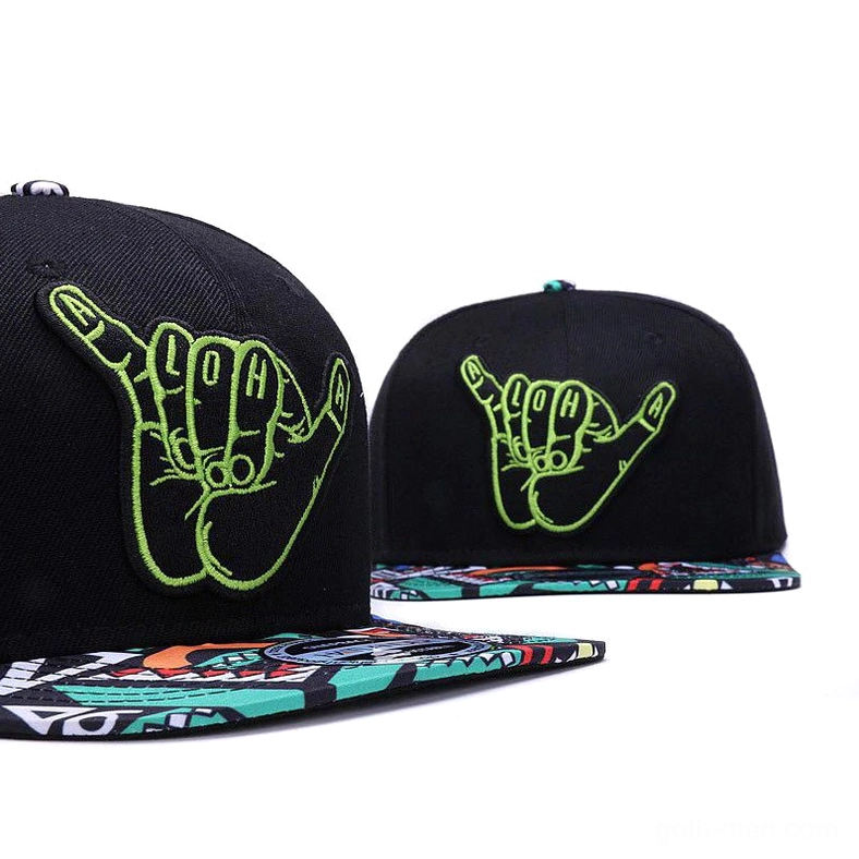 Side-by-side comparison of black gothic snapback caps showing hand embroidery details and geometric brim pattern