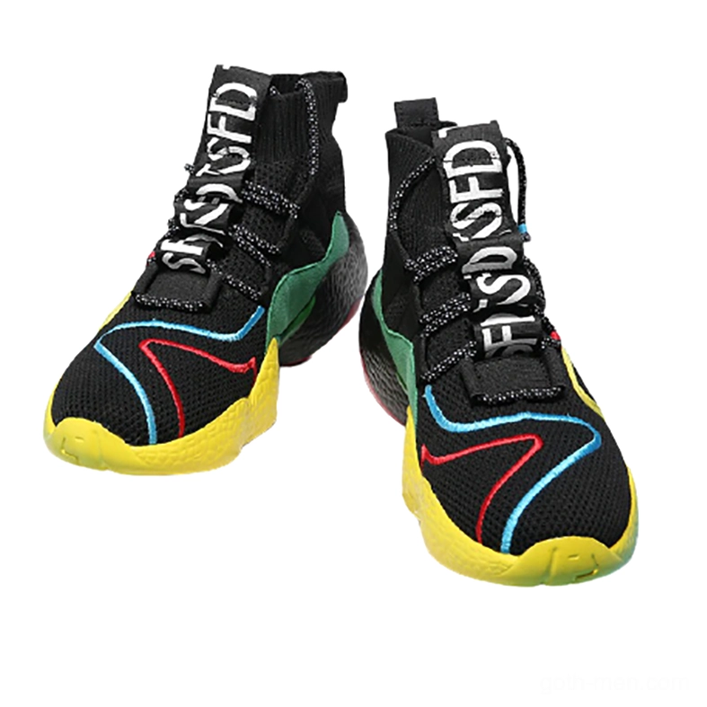 Pair of matching black gothic high-top sneakers with red blue yellow trim overhead view, alternative street wear