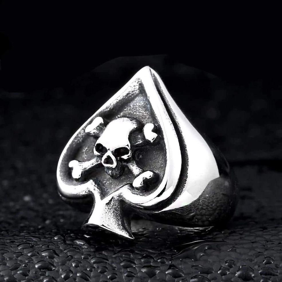 High gloss silver stainless steel gothic spade skull ring side angle showing dimensional depth of embossed design