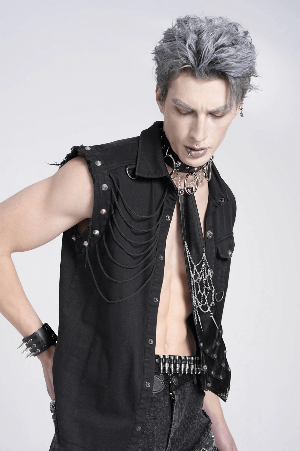 Close-up of gothic spider web chain necktie showing studded details and metal hardware components