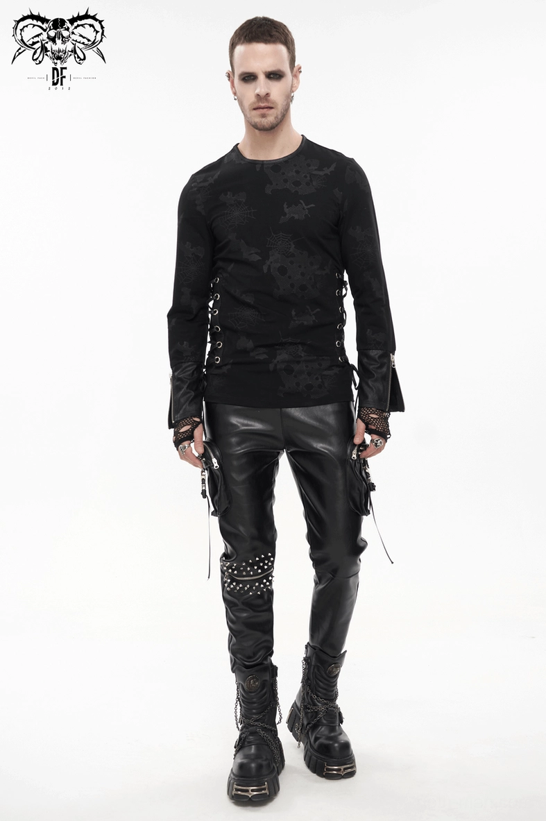 Front full-body view of man wearing black gothic spider web sweatshirt with leather pants and boots, slim fitted alternative look