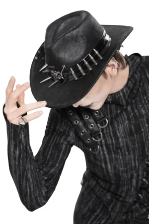 Spiked bullet trim gothic western hat side profile view on male model in dark fashion shoot