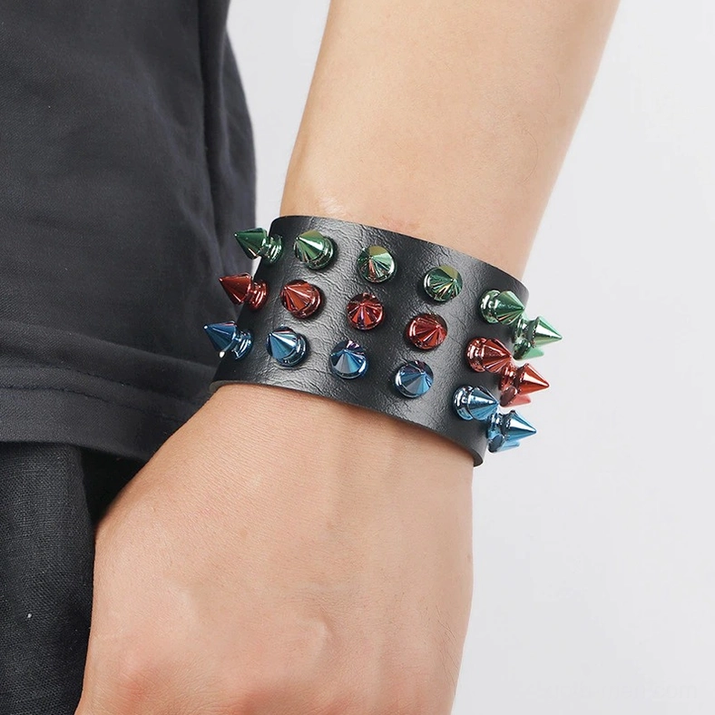 Gothic spike leather cuff bracelet worn on wrist close-up showing real-world styling and multicolor metal cone spike effect